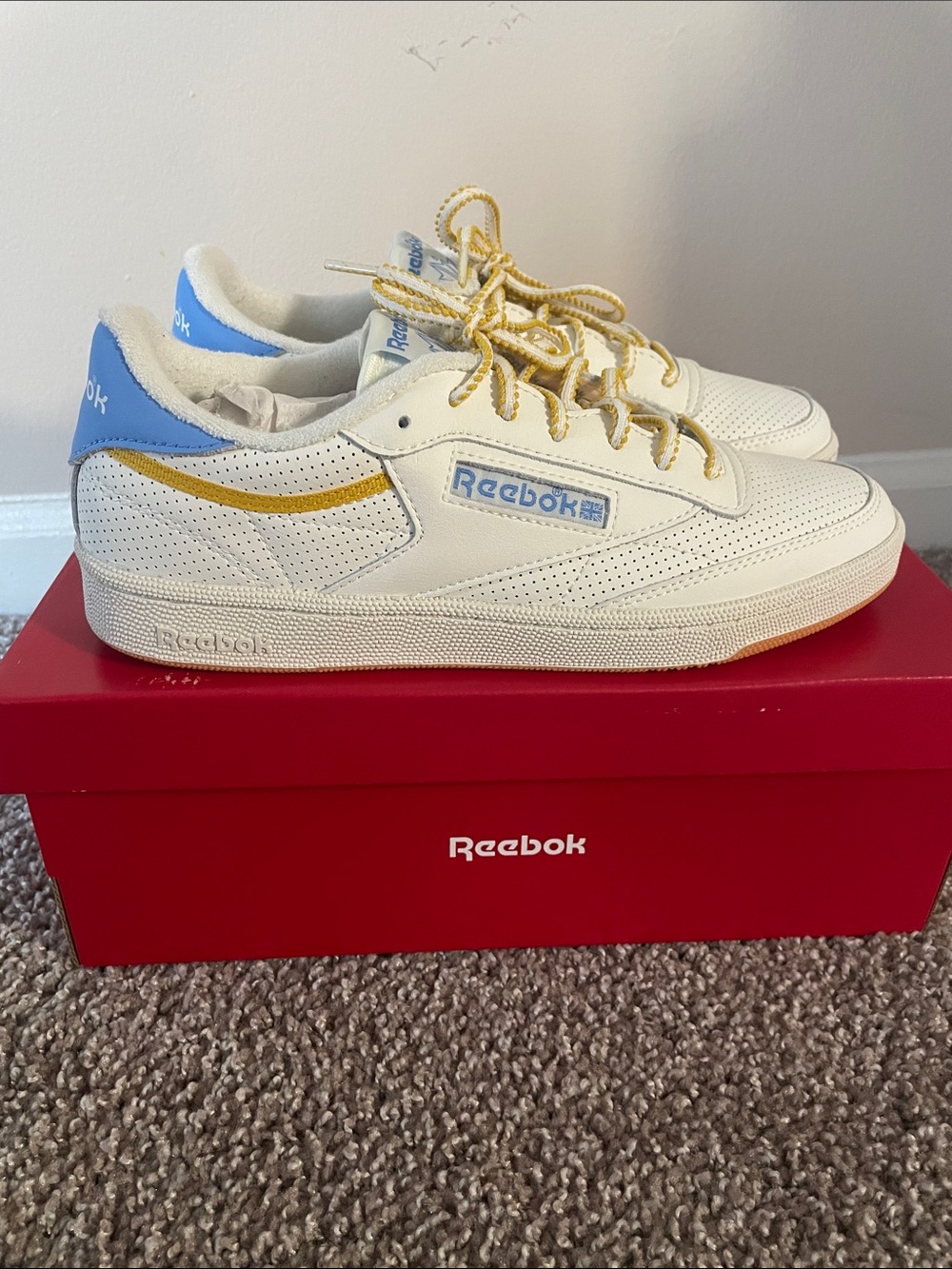 Reebok women’s White Sneakers with Blue Heel and Gold Accents